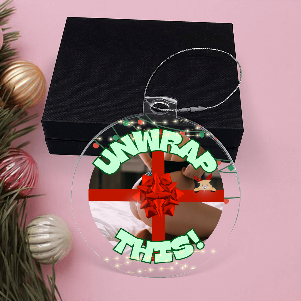 Naughty holiday acrylic ornament with “Unwrap This” design