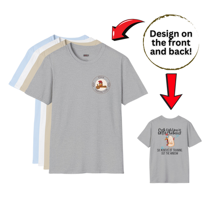 Gray t-shirt with a design on the front and back, surrounded by other t-shirts.